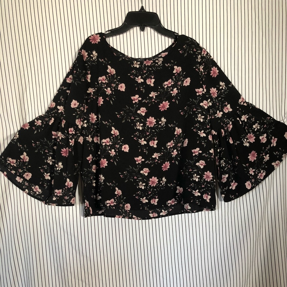 Black floral blouse.